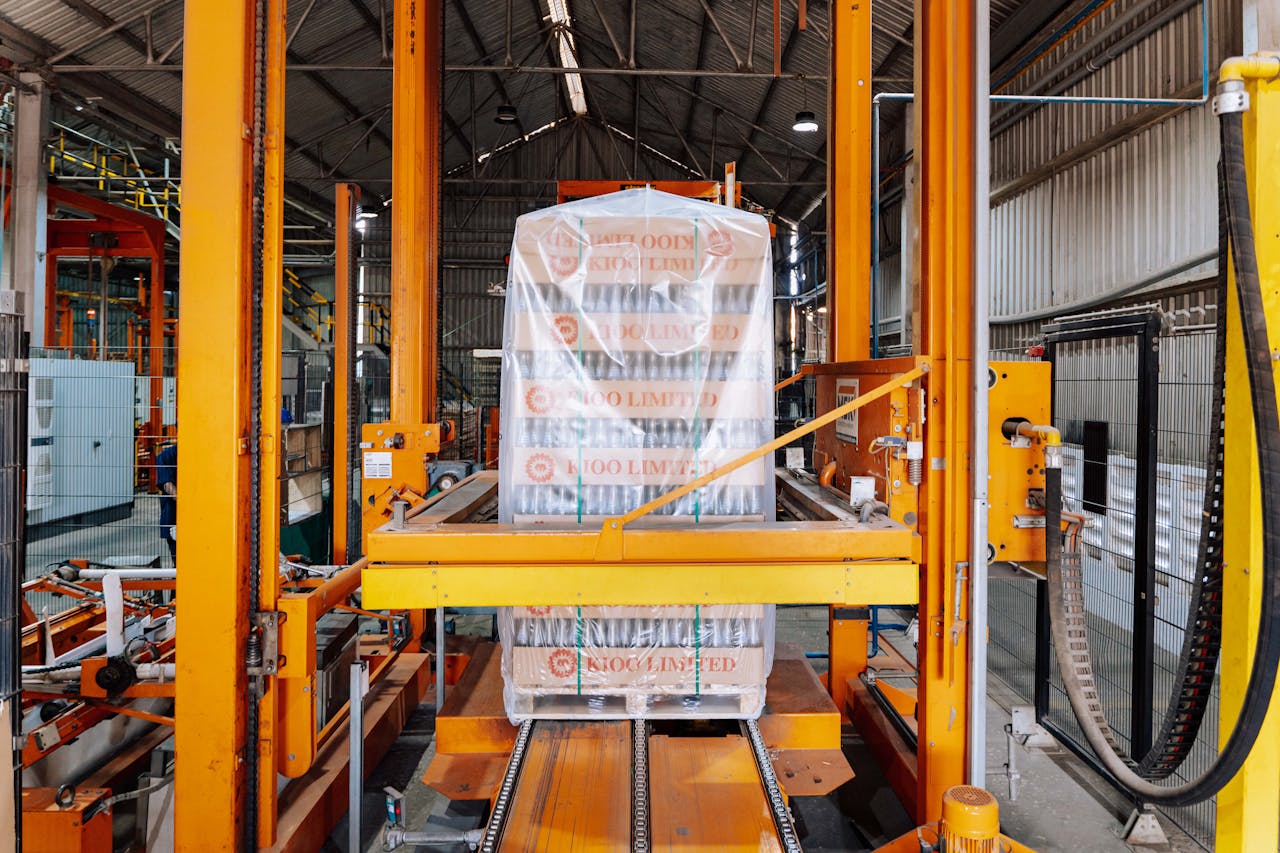 An industrial machine in a glass factory showcasing automated packaging in Dar es Salaam.